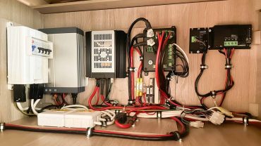 Electrical wiring and control panel for RV solar setup.