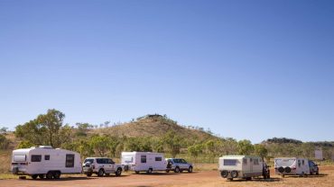 RV camping with caravans and vehicles at Big Lap Bible, scenic outdoor setting in Australia.