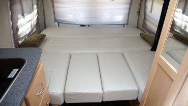 Buying a Caravan: Do You Need A Convertible Lounge (Extra Bed)? [Decision Guide]
